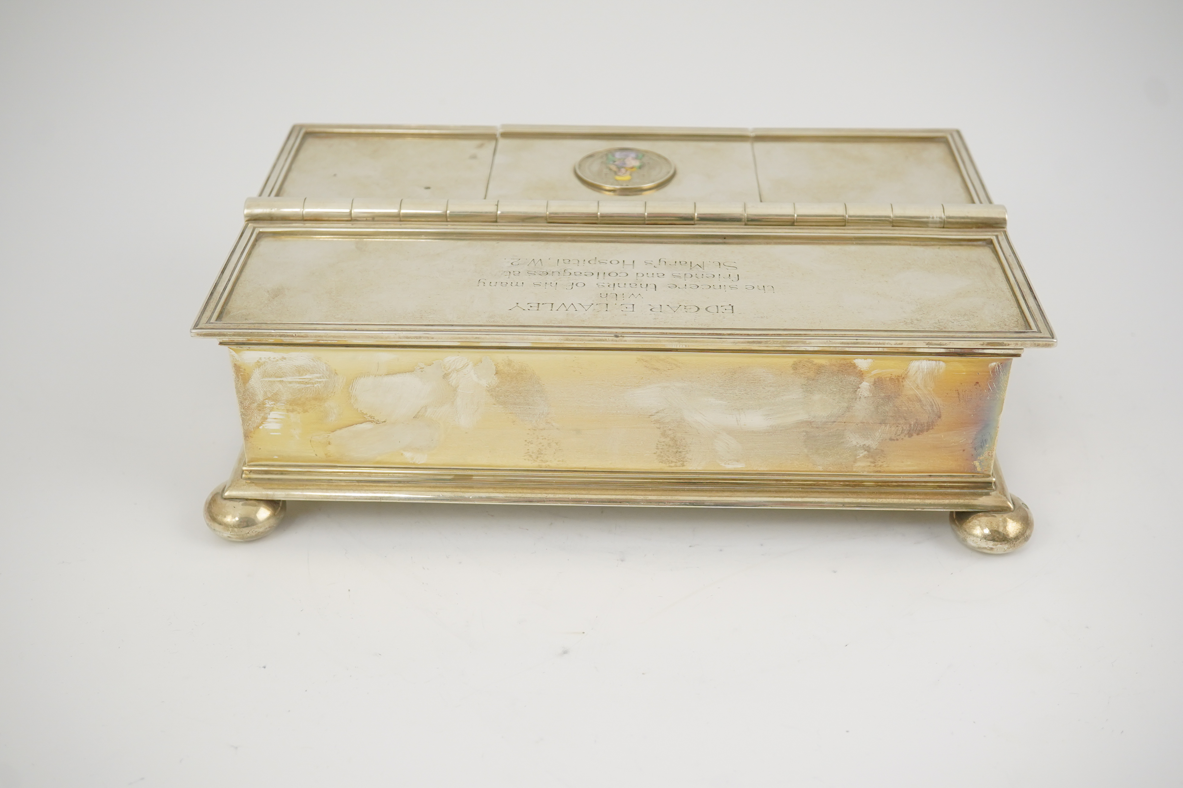 A George V Britannia standard silver and enamel combination ‘treasury inkstand/ cigarette box, by Crichton Brothers